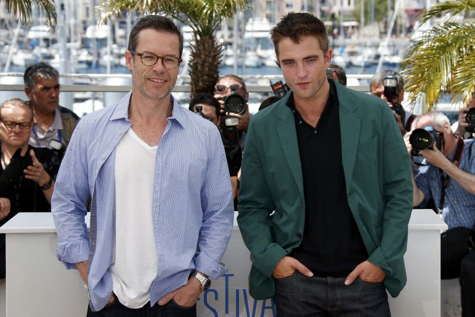 Cast member Guy Pearce and Robert Pattinson pose during a photocall for the film quotThe Roverquot out of competition at the 67th Cannes Film Festival in Cannes