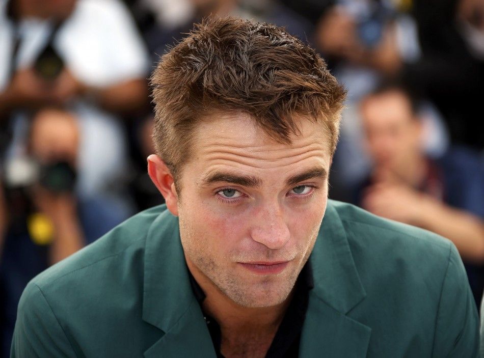 Cast member Robert Pattinson poses during a photocall for the film quotThe Roverquot out of competition at the 67th Cannes Film Festival in Cannes