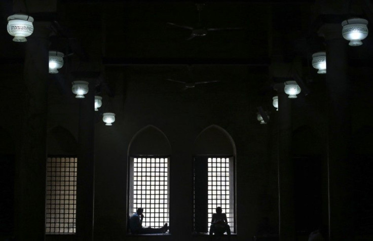 Men read the Koran at Al-Azhar Mosque, in the old Islamic area of Cairo