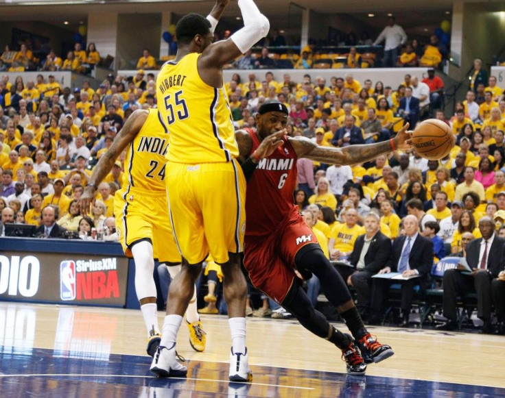 May 18, 2014; Indianapolis, IN, USA; Miami Heat forward LeBron James (6) drives to the basket against Indiana Pacers center Roy Hibbert (55) in game one of the Eastern Conference Finals of the 2014 NBA Playoffs at Bankers Life Fieldhouse.