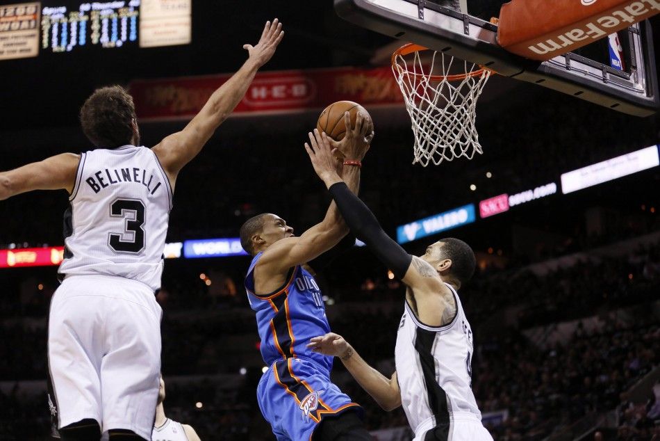 May 19, 2014 San Antonio, TX, USA Oklahoma City Thunder guard Russell Westbrook 0 drives to the basket as San Antonio Spurs forward Marco Belinelli 3 and Danny Green right defend in game one of the Western Conference Finals in the 2014 NBA Playoff