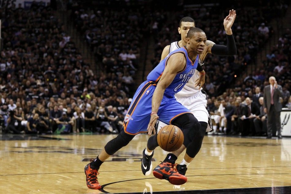 May 19, 2014 San Antonio, TX, USA Oklahoma City Thunder guard Russell Westbrook front drives to the basket past San Antonio Spurs guard Danny Green behind in game one of the Western Conference Finals in the 2014 NBA Playoffs at ATT Center. 
