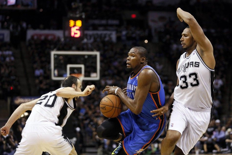 May 19, 2014 San Antonio, TX, USA San Antonio Spurs guard Manu Ginobili left knocks the ball away from Oklahoma City Thunder forward Kevin Durant center in game one of the Western Conference Finals in the 2014 NBA Playoffs at ATT Center. 