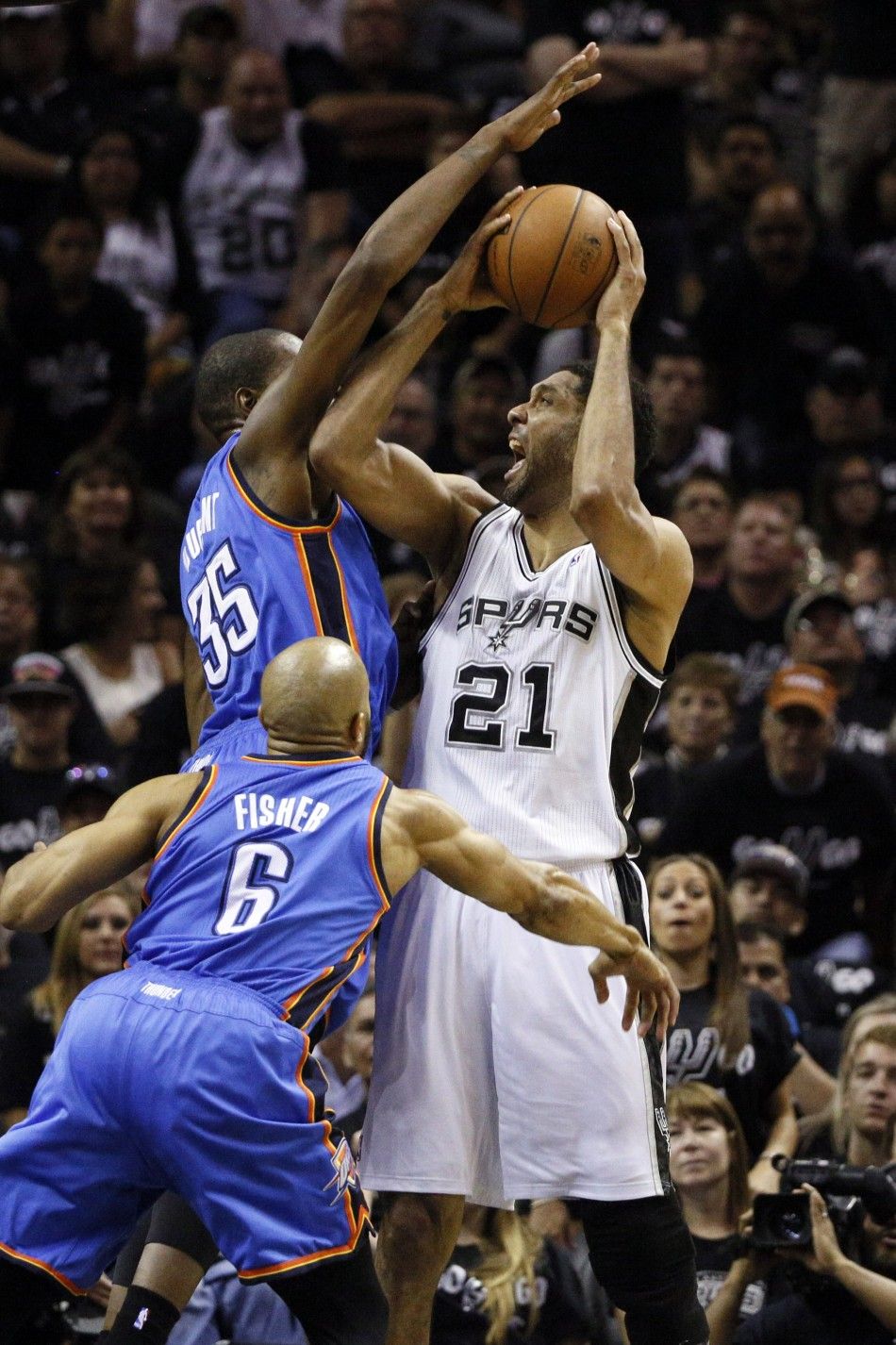 May 19, 2014 San Antonio, TX, USA San Antonio Spurs forward Tim Duncan 21 is fouled while shooting by Oklahoma City Thunder forward Kevin Durant 35 in game one of the Western Conference Finals in the 2014 NBA Playoffs at ATT Center. 