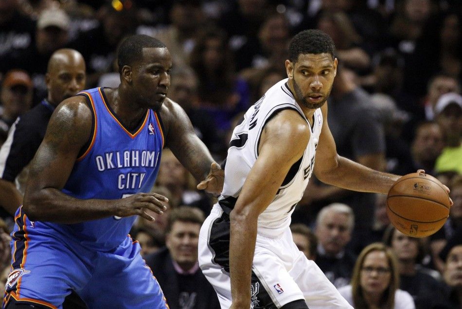 May 19, 2014 San Antonio, TX, USA San Antonio Spurs forward Tim Duncan right posts up against Oklahoma City Thunder center Kendrick Perkins left in game one of the Western Conference Finals in the 2014 NBA Playoffs at ATT Center. 