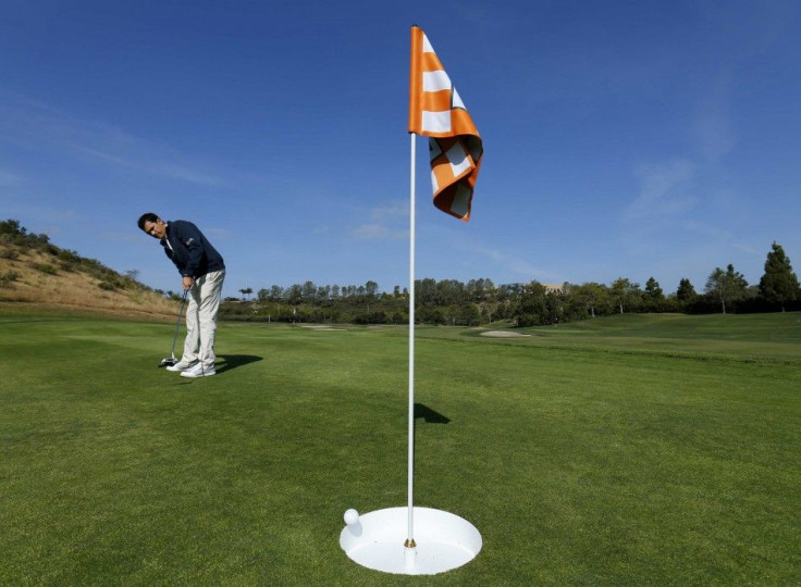 Dave Cordero of TaylorMade putts into a 15-inch inch hole at his company&#039;s golf facility in Carlsbad, California