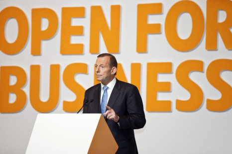 Australian Prime Minister Abbott gestures as he gives a speech at the Shanghai International Expo Centre in Shanghai