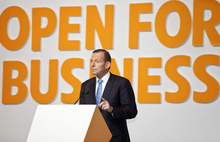 Australian Prime Minister Abbott gestures as he gives a speech at the Shanghai International Expo Centre in Shanghai