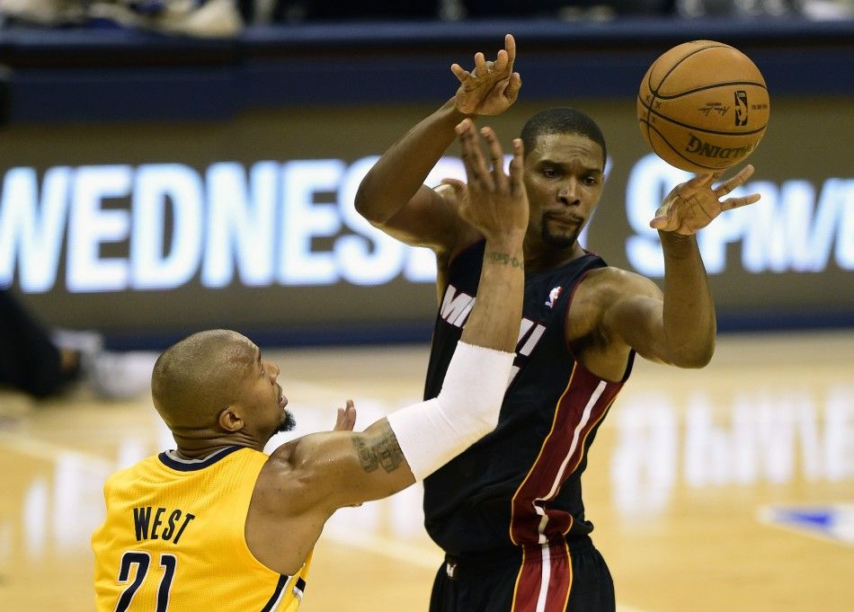 May 20, 2014 Indianapolis, IN, USA Miami Heat center Chris Bosh 1 passes the ball around Indiana Pacers forward David West 21 during the second half of game two of the Eastern Conference Finals of the 2014 NBA Playoffs at Bankers Life Fieldhouse. Th