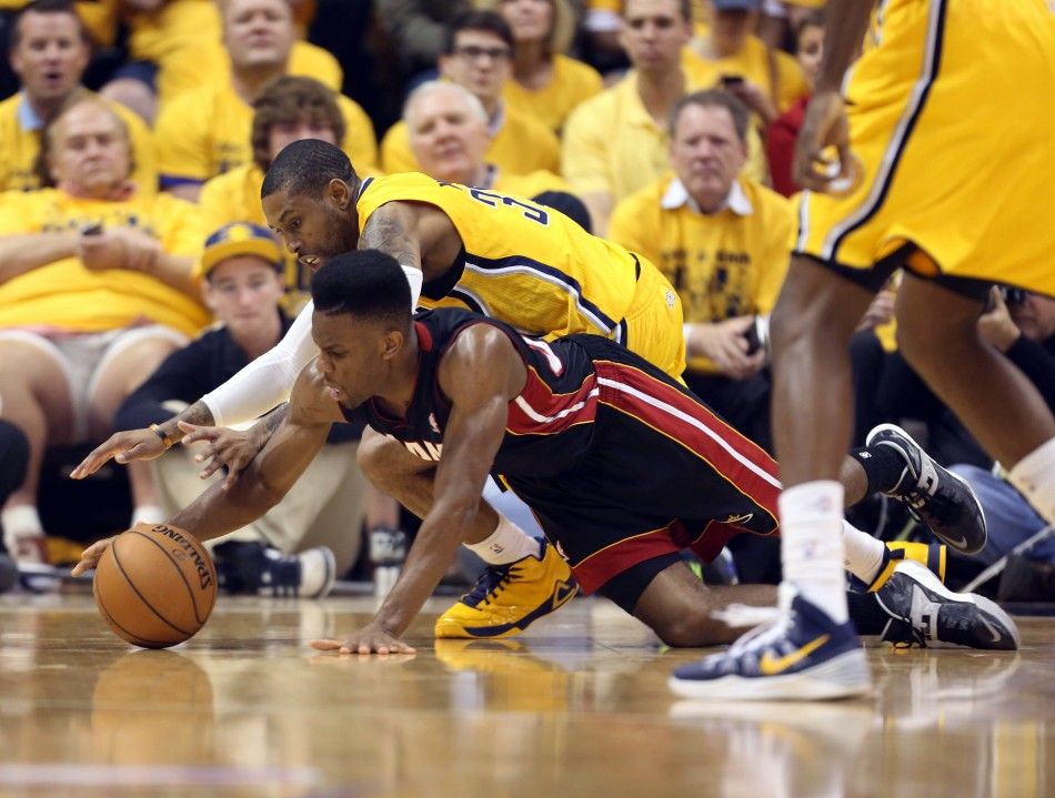 May 20, 2014 Indianapolis, IN, USA Miami Heat guard Norris Cole 30 scrambles for a loose ball against Indiana Pacers guard C.J. Watson 32 in game two of the Eastern Conference Finals of the 2014 NBA Playoffs at Bankers Life Fieldhouse. 