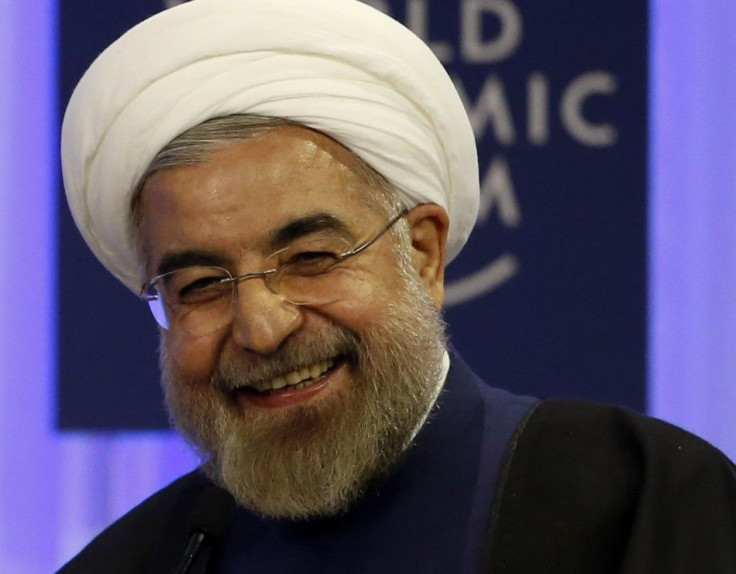 Iran&#039;s President Rouhani smiles during session of World Economic Forum in Davos