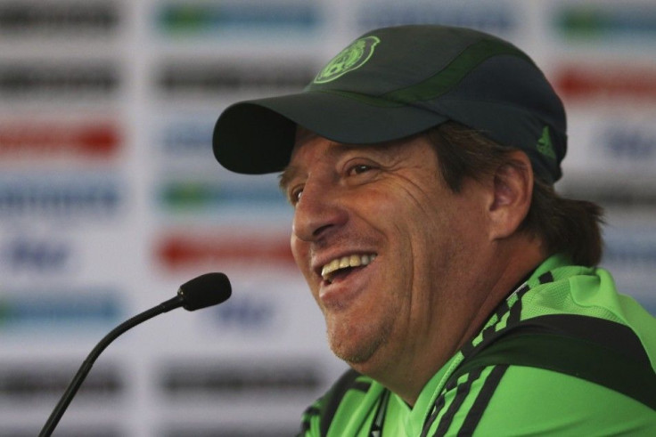 Mexico's coach Miguel Herrera smiles during a news conference after a practice session in Mexico City May 21, 2014. Mexico will play an international friendly match against Israel on May 28 in Mexico City.