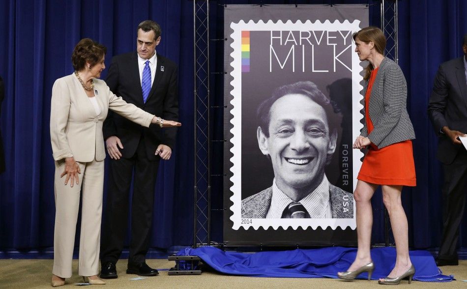 House Minority Leader Nancy Pelosi L talks with President of the Harvey Milk Foundation Stuart Milk C, next to U.S. Ambassador to the UN Samantha Power, after they unveiled the Harvey Milk Forever Stamp at its dedication ceremony at the White House in