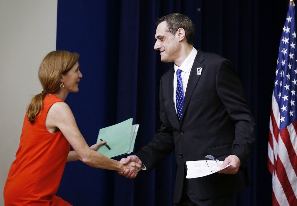 President of the Harvey Milk Foundation Stuart Milk R welcomes U.S. Ambassador to the UN Samantha Power L before they unveil the Harvey Milk Forever Stamp at its dedication ceremony at the White House in Washington May 22, 2014. The ceremony marks the