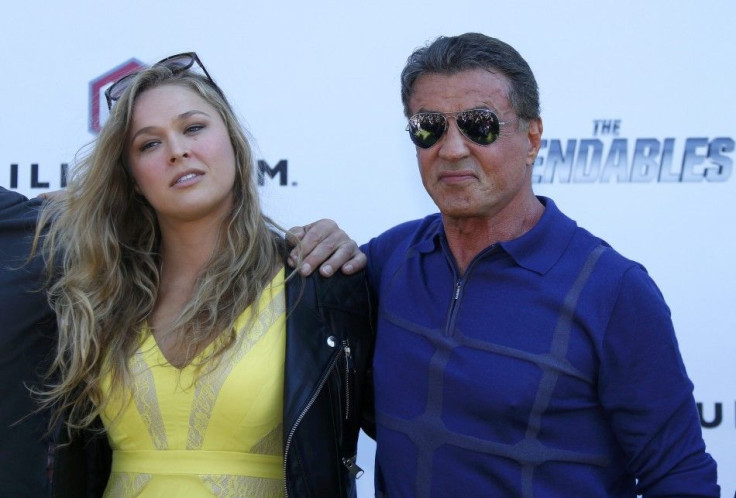 Cast members Ronda Rousey (L) and Sylvester Stallone pose during a photocall on the Croisette to promote the film &quot;The Expendables 3&quot; during the 67th Cannes Film Festival in Cannes May 18, 2014. 