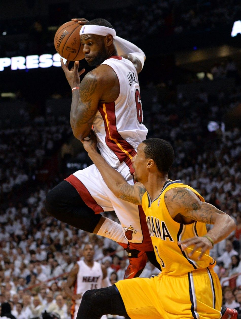 May 24, 2014 Miami, FL, USA Miami Heat forward LeBron James 6 goes up to pull in a pass over Indiana Pacers guard George Hill 3 in game three of the Eastern Conference Finals of the 2014 NBA Playoffs at American Airlines Arena
