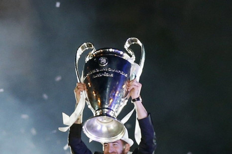 Real Madrid vice captain Sergio Ramos celebrates with the trophy after winning the Champions League