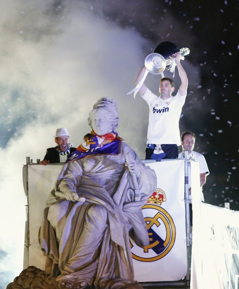 Real Madrid captains Iker Casillas and Sergio Ramos celebrate with the trophy