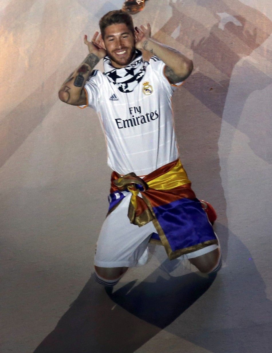Real Madrids Sergio Ramos gestures to cheering fans