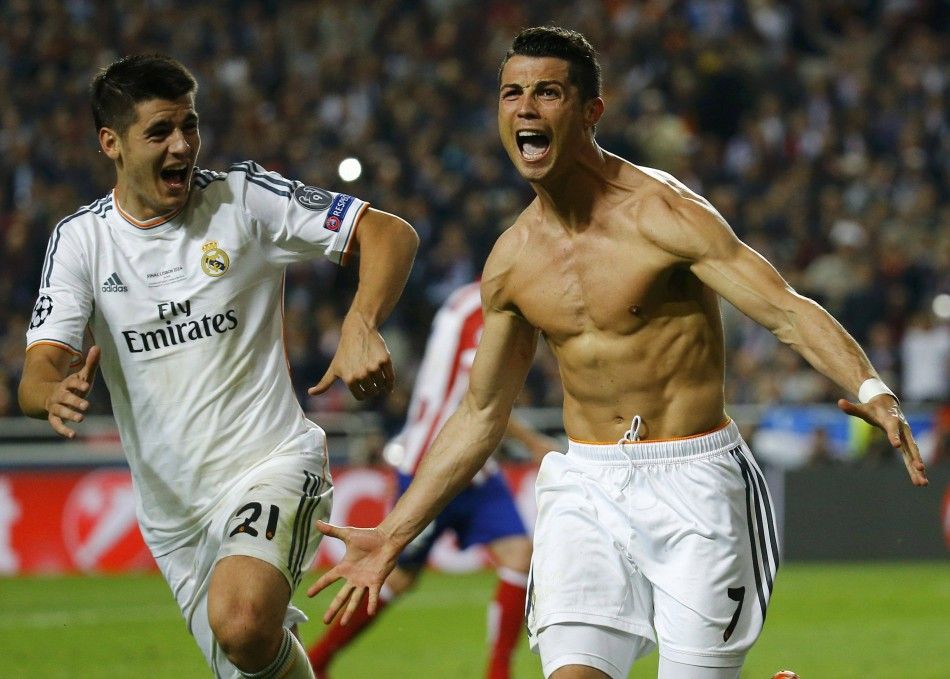 Real Madrids Cristiano Ronaldo R celebrates with team mate Alvaro Morata