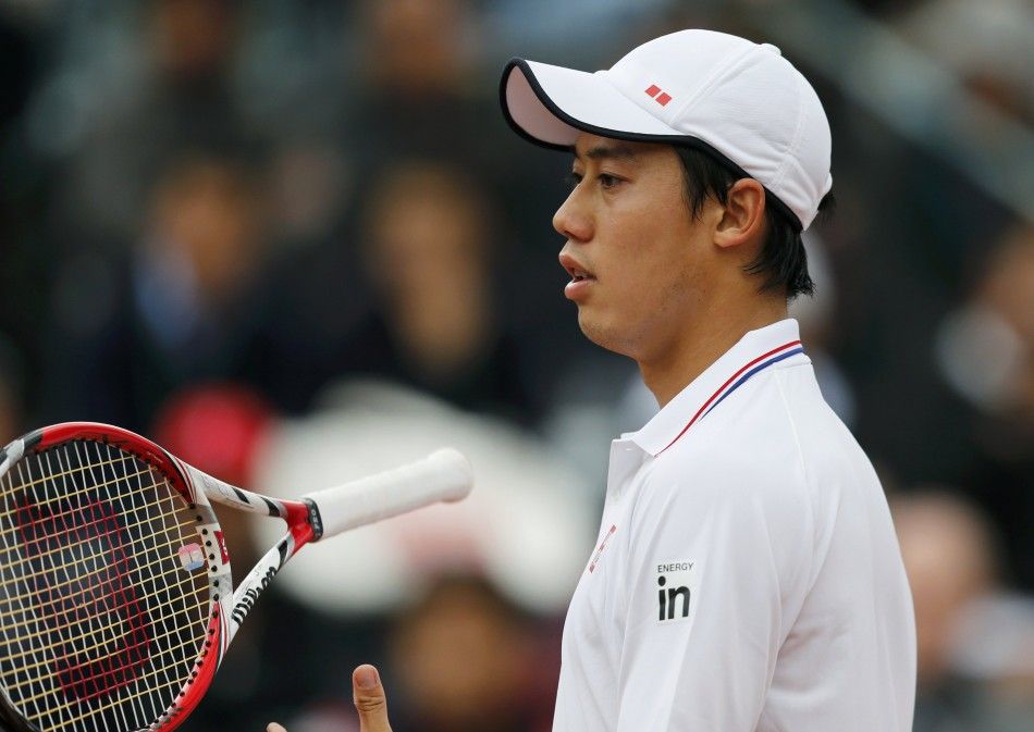 Kei Nishikori of Japan reacts during his mens singles match against Martin Klizan of Slovakia at the French Open tennis tournament at the Roland Garros stadium in Paris May 26, 2014. 
