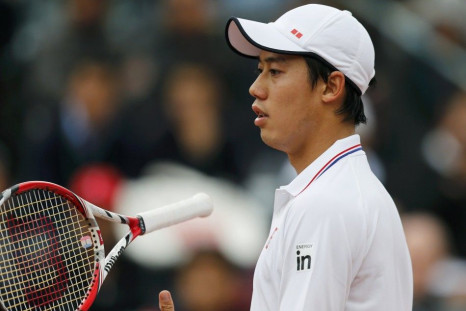 Kei Nishikori of Japan reacts during his men's singles match against Martin Klizan of Slovakia at the French Open tennis tournament at the Roland Garros stadium in Paris May 26, 2014. 