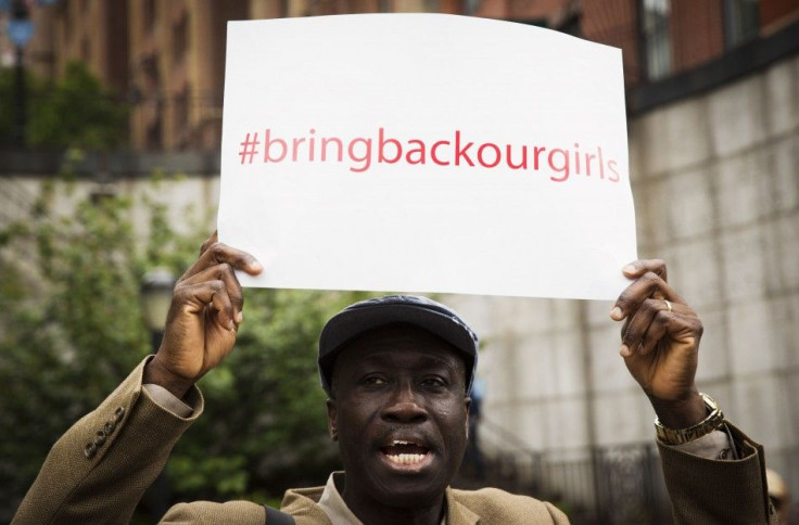 A demonstrator holds sign while chanting for release of Nigerian schoolgirls in Chibok kidnapped by Boko Haram, outside of UN headquarters in New York