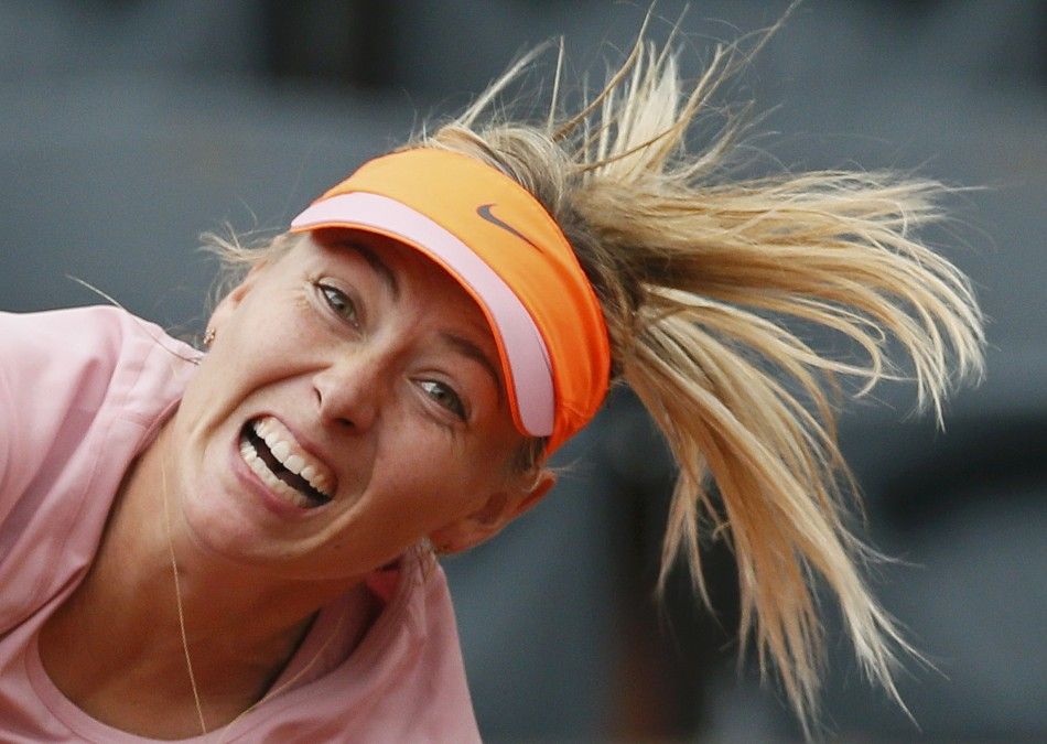 Maria Sharapova of Russia serves to compatriot Ksenia Pervak during their womens singles match at the French Open tennis tournament at the Roland Garros stadium in Paris May 26, 2014. 