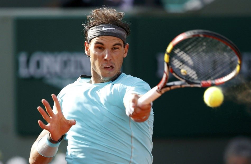 Rafael Nadal of Spain returns the ball to Robby Ginepri of the U.S. during their mens singles match at the French Open tennis tournament at the Roland Garros stadium in Paris May 26, 2014. 