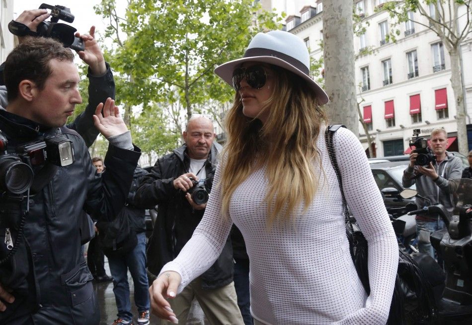 Television Personality Khloe Kardashian Walks Past Photographers in Paris