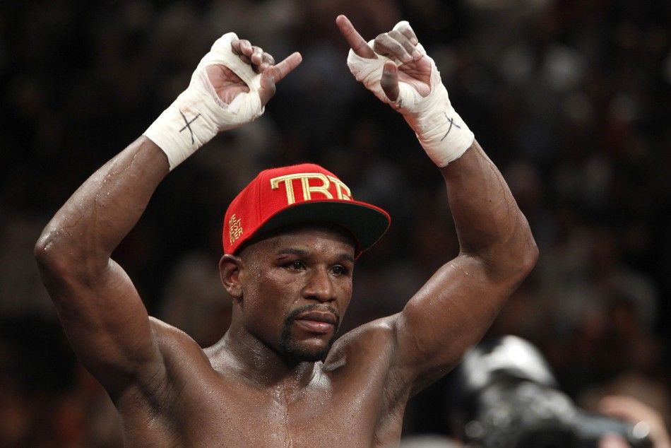 Floyd Mayweather Jr. of the U.S. celebrates his victory over Marcos Maidana of Argentina following their WBCWBA welterweight unification fight at the MGM Grand Garden Arena in Las Vegas, Nevada, May 3, 2014. Mayweather improved his record to 46-0. REUTER
