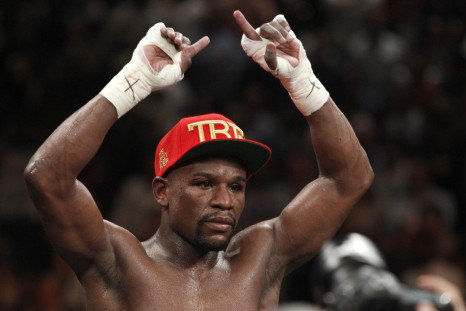 Floyd Mayweather Jr. of the U.S. celebrates his victory over Marcos Maidana of Argentina following their WBC/WBA welterweight unification fight at the MGM Grand Garden Arena in Las Vegas, Nevada, May 3, 2014. Mayweather improved his record to 46-0. REUTER