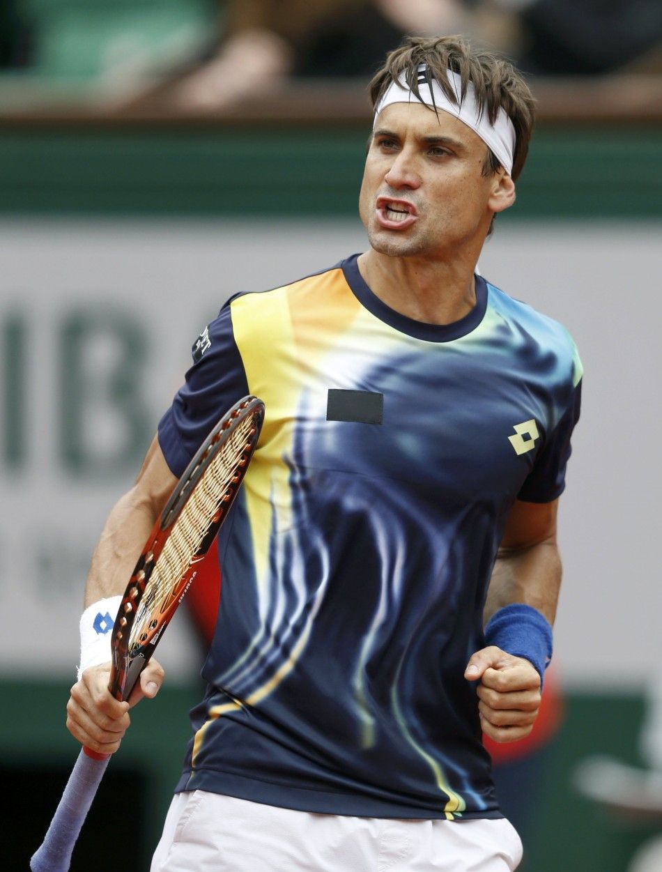 David Ferrer of Spain reacts during his mens singles match against Igor Sijsling of the Netherlands at the French Open tennis tournament at the Roland Garros stadium in Paris May 27, 2014. 