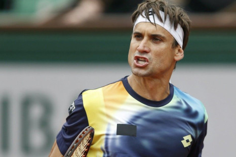 David Ferrer of Spain reacts during his men's singles match against Igor Sijsling of the Netherlands at the French Open tennis tournament at the Roland Garros stadium in Paris May 27, 2014. 