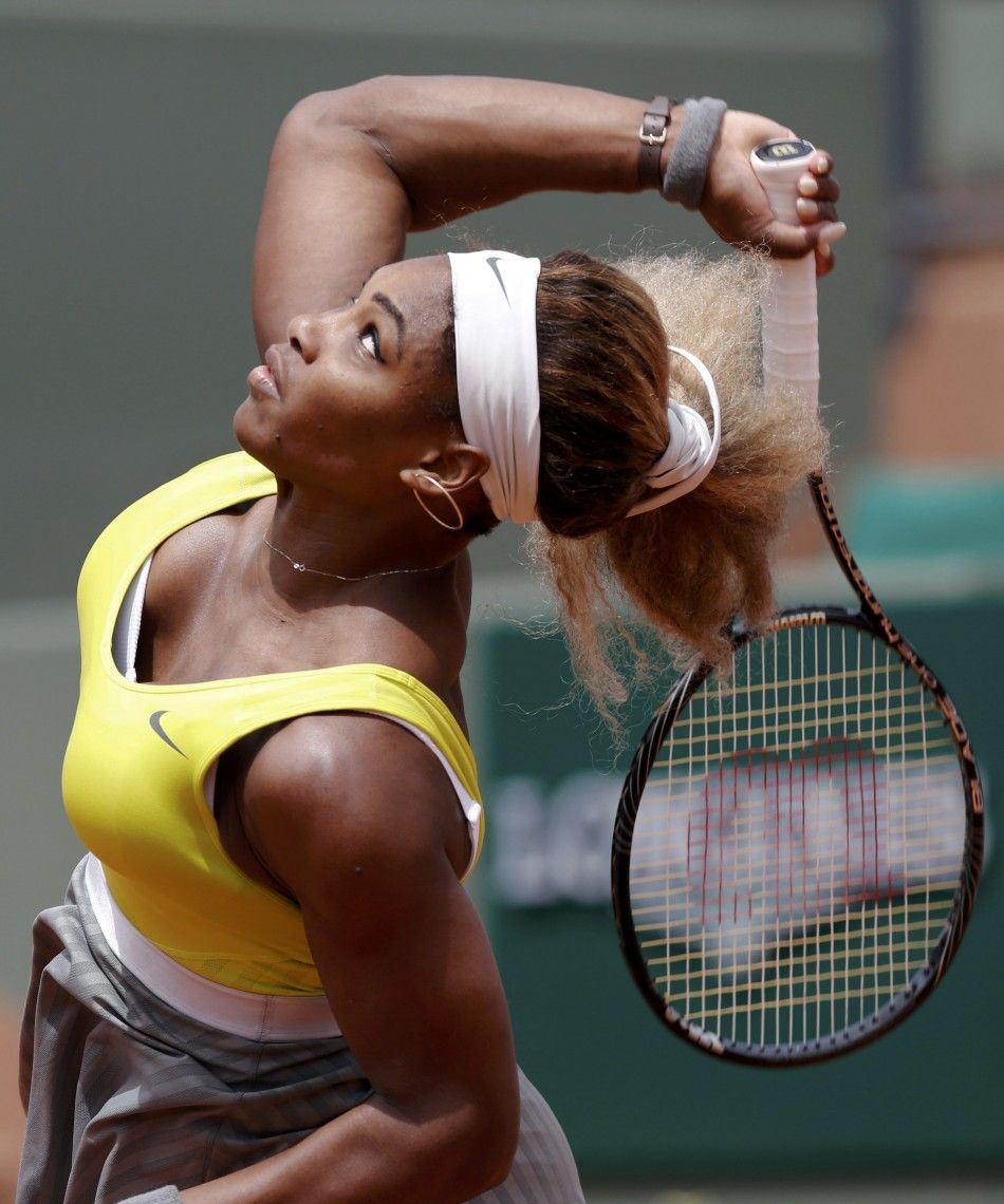 Serena Williams of the U.S. competes in a womens singles match against Garbine Muguruza of Spain at the French Open tennis tournament at the Roland Garros stadium in Paris May 28, 2014. 
