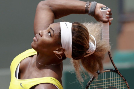 Serena Williams of the U.S. competes in a women's singles match against Garbine Muguruza of Spain at the French Open tennis tournament at the Roland Garros stadium in Paris May 28, 2014. 