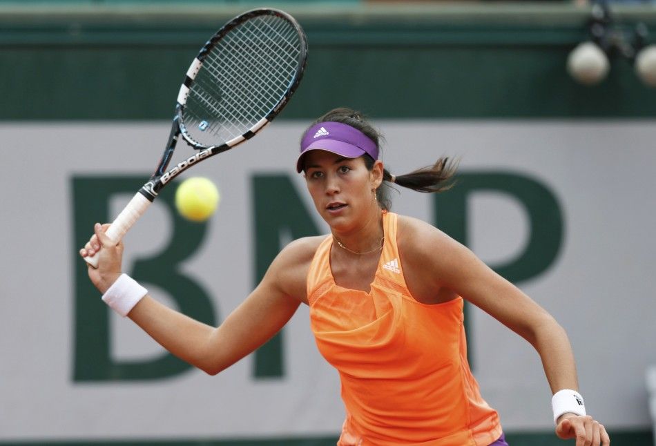 Garbine Muguruza of Spain returns a forehand to Serena Williams of the U.S. during their womens singles match at the French Open tennis tournament at the Roland Garros stadium in Paris May 28, 2014. 