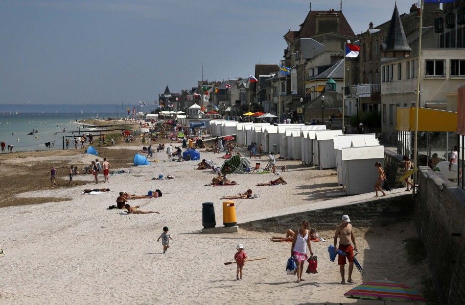 Tourists Enjoy the Sunshine on the Former Juno Beach D-Day Landing Zone in Saint-Aubin-sur-Mer
