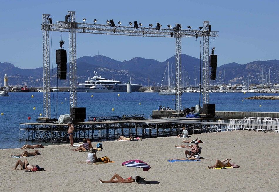 People Enjoy the Sun on a Beach as Preparations Continue for Beach Front Cinema Screenings on the Croisette on the Eve of the Opening of the 67th Cannes Film Festival in Cannes