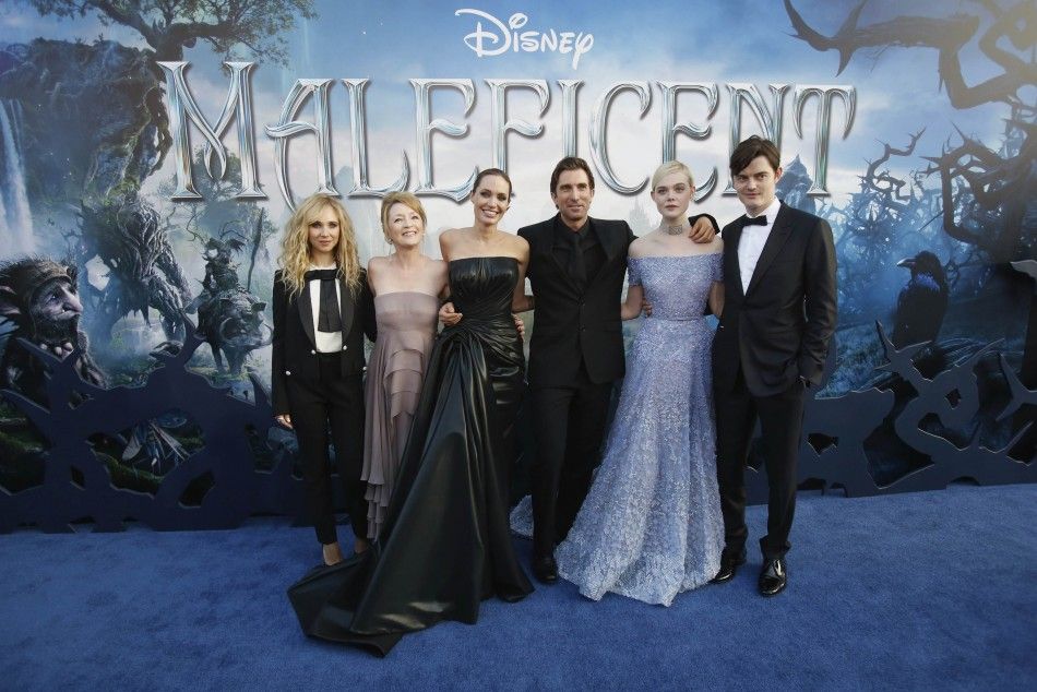 Cast members L-R Juno Temple, Lesley Manville, Angelina Jolie, Sharlto Copley, Elle Fanning and Sam Riley pose at the premiere of quotMaleficentquot 