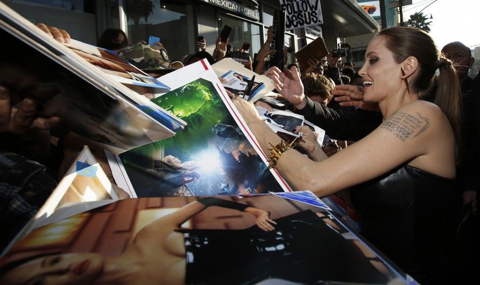 Cast member Angelina Jolie signs autographs at the premiere of quotMaleficentquot 