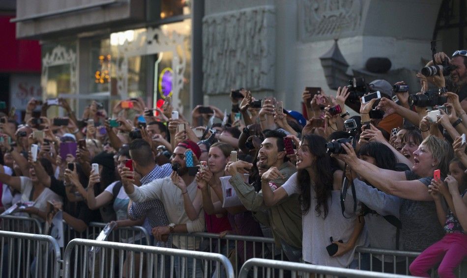 Fans cheer as cast member Angelina Jolie and actor Brad Pitt not pictured arrive at the premiere of quotMaleficentquot
