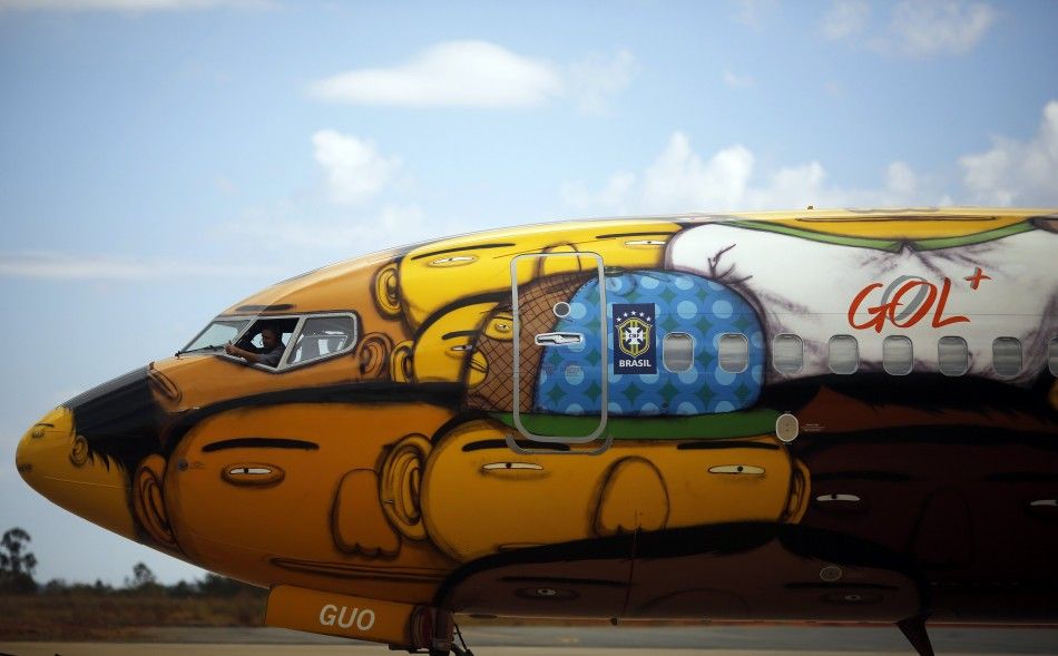 A technician works inside the Boeing 737 aircraft of Brazilian airline Gol, 