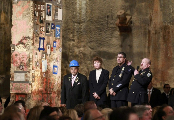 First responders Manny Rodriguez, Pia Hofmann, Det. Anthony Favara, of the NYPD and Lt. Stephen Butler, of the Port Authority Police, speak next to the &quot;Last Beam&quot; during the dedication ceremony at the National September 11 Memorial Museum in Ne