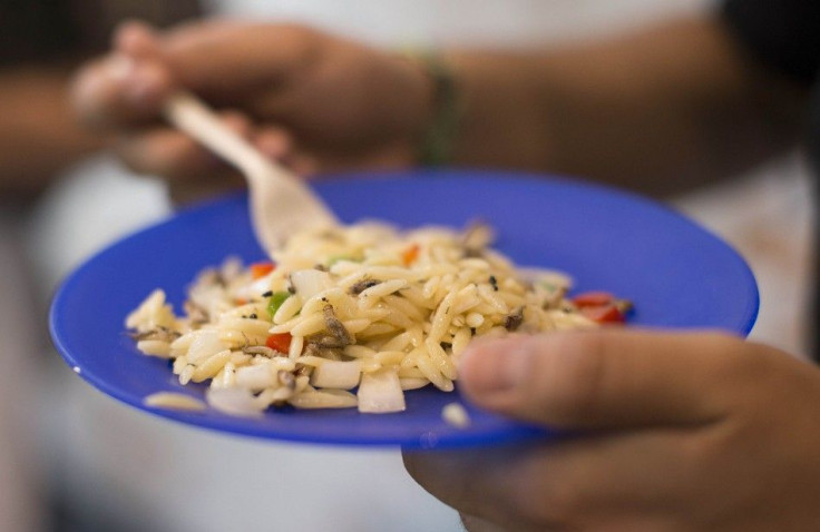 A tourist eats orzo pasta with crickets during &quot;Bug Chef&quot; David Gordon&#039;s 4th annual &quot;Bug-A-Thon&quot; event at Ripley&#039;s Believe It or Not museum in Hollywood