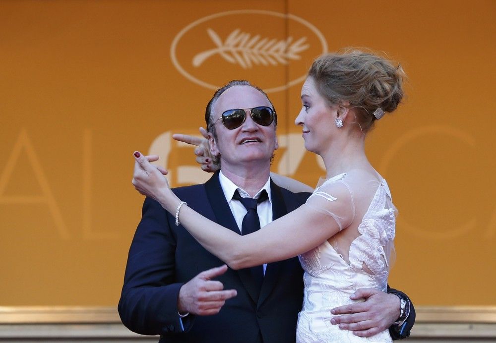 Director Quentin Tarantino and Actress Uma Thurman Pose on the Red Carpet as They A at the Closing Ceremony of the 67th Cannes Film Festival