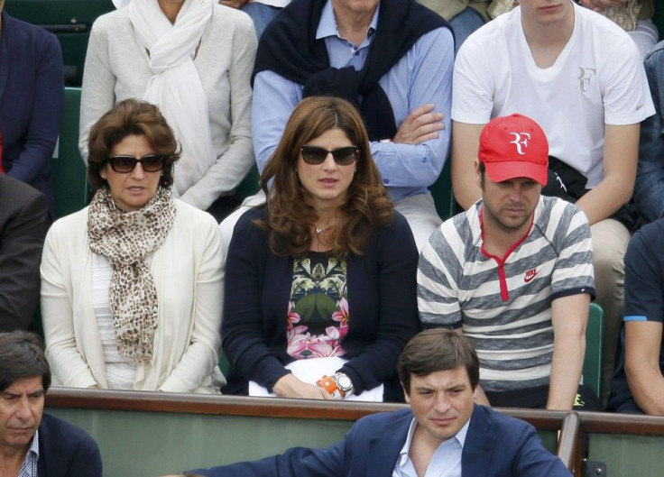 Mirka Federer (C), wife of Roger Federer of Switzerland, watches her husband competing in a men's singles match against Dmitry Tursunov of Russia at the French Open tennis tournament at the Roland Garros stadium in Paris May 30, 2014. 