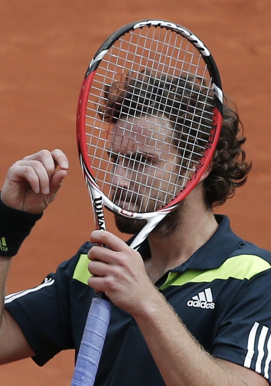 Ernests Gulbis of Latvia reacts during his mens singles match against Roger Federer of Switzerland at the French Open tennis tournament at the Roland Garros stadium in Paris June 1, 2014. 