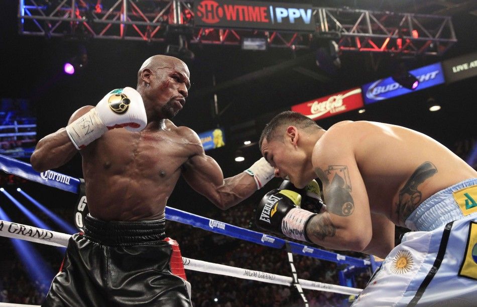 Floyd Mayweather Jr. L of the U.S. punches at Marcos Maidana of Argentina during their WBCWBA welterweight unification fight at the MGM Grand Garden Arena in Las Vegas, Nevada, May 3, 2014. REUTERSSteve Marcus