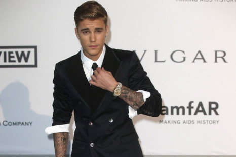Canadian pop singer Justin Bieber arrives for amfAR's Cinema Against AIDS 2014 event in Antibes during the 67th Cannes Film Festival May 22, 2014. REUTERS/Benoit Tessier 